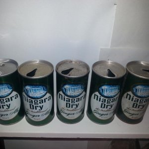 5 Niagara Dry cans. The one on the left has a different opening.