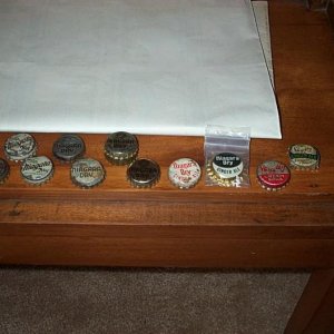 Larger collection of Niagara Dry bottlecaps including a Sky-Hy Cream Soda variant.