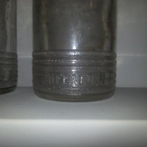 Bottom portion of bottle reads "BUFFALO N.Y." on one side, "12 FL. OZS." on the other.