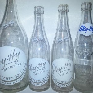 Sky-Hy bottle collection. Still looking for Ginger Ale, Cream Soda, Lemon-Lime, Orange and Root Beer bottles with the paper labels.