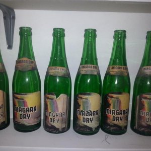 Various variations of Niagara Dry bottles with the rainbow falls labels.