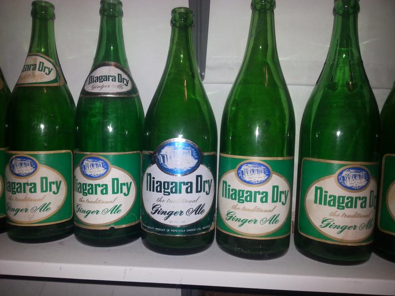 Some paper label variants of 30oz bottles. Second one from the left has foil labels.
